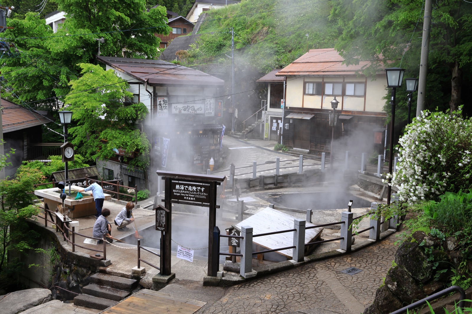 Nozawa Onsen village with thermal steam rising from the ground